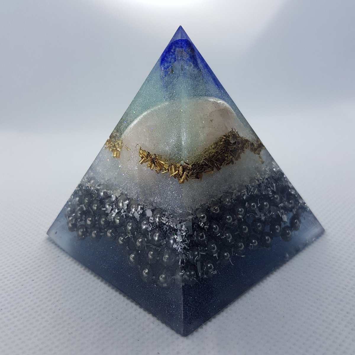 Unchained Brilliance Orgone Orgonite Pyramid 6cm - Lapis Lazuli Point and Rose Quartz filling the void with love, Brass, and Steel on top of a rugged Tourmaline chunk