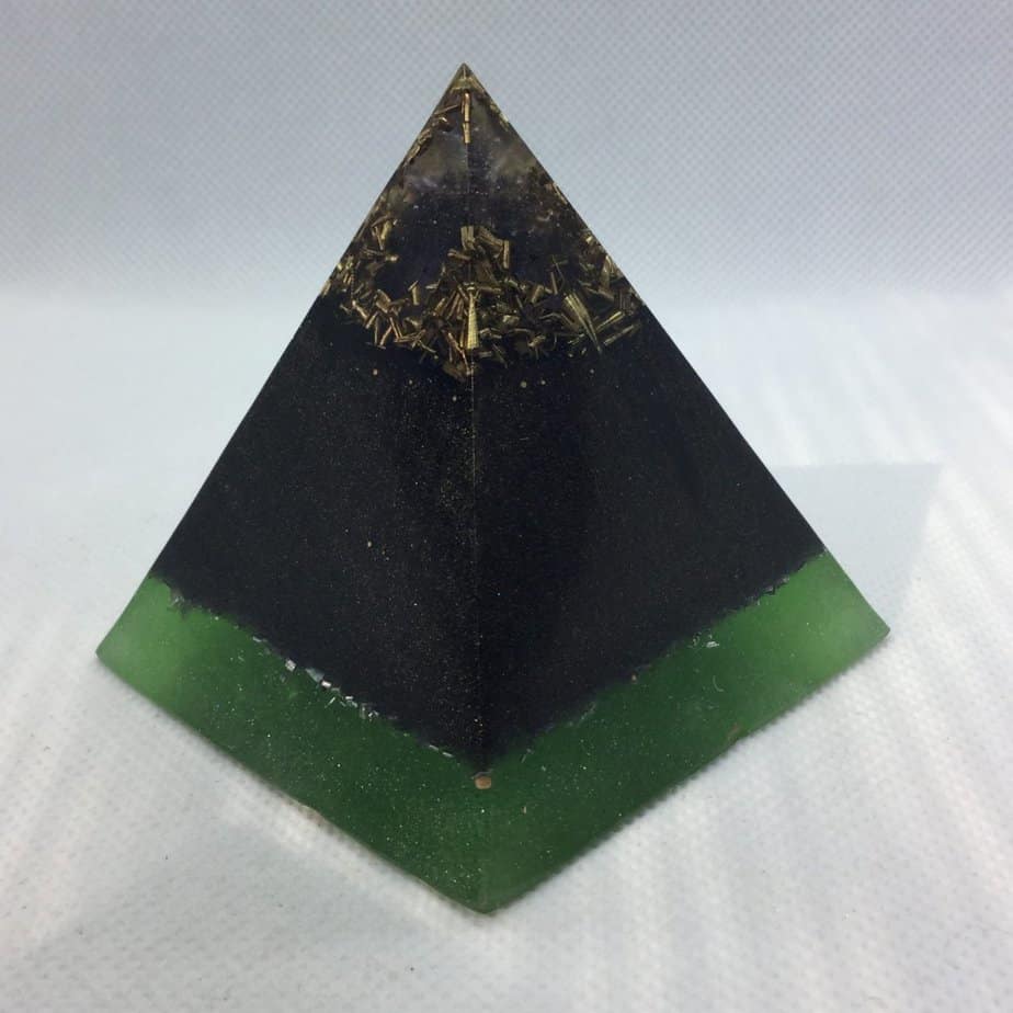 Light after Darkness Orgone Orgonite Pyramid 6cm - When all seems hard, a Amethyst Point raising out of darkness, with the protection of Shungite and Brass, and a Mexico Peso for Luck