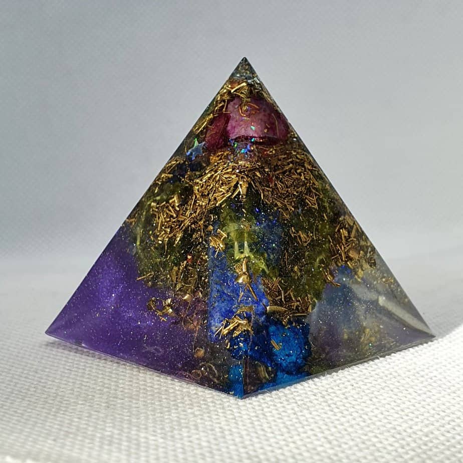 Gravity Lifts Lapis Lazuli Orgone Orgonite Pyramid 5cm - Lapis Lazuli, Peridot, Blue Quartz, Purple Quartz, Herkimer Diamonds, Brass and more in this unforgettable Orgonite