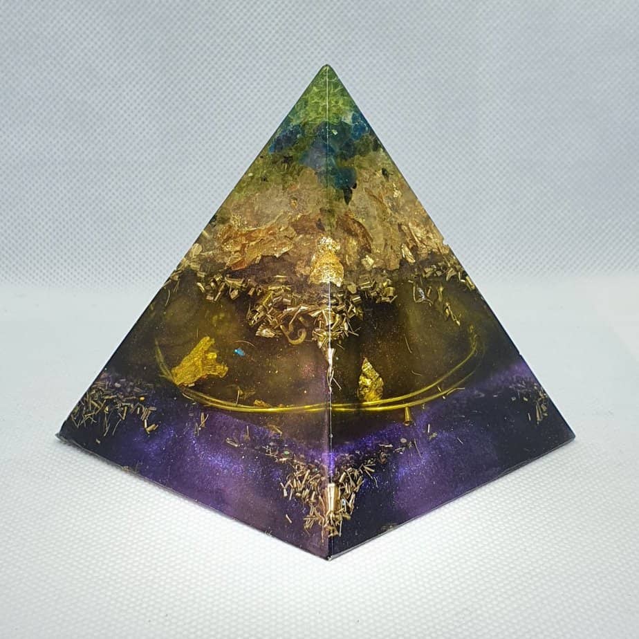 Ethereal Body Orgone Orgonite Pyramid 9cm - Float away with this Orgonite is like looking into the depth of space...with a heart beating of a Blue Topaz, Peridot, Gold, Brass and Jet, Obsidian and Large Tourmaline chunk