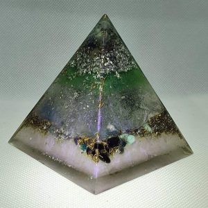 Neutron Star III EMF Protection Orgone Orgonite Pyramid 8cm -This Awesome peaceful and calming Orgonite, filled with Amazonite, Celestite, Moonstone, Obsidian, a huge Clear Quartz core, Silver, Aluminium and Brass, finally a 2 Peso coin from Mexico